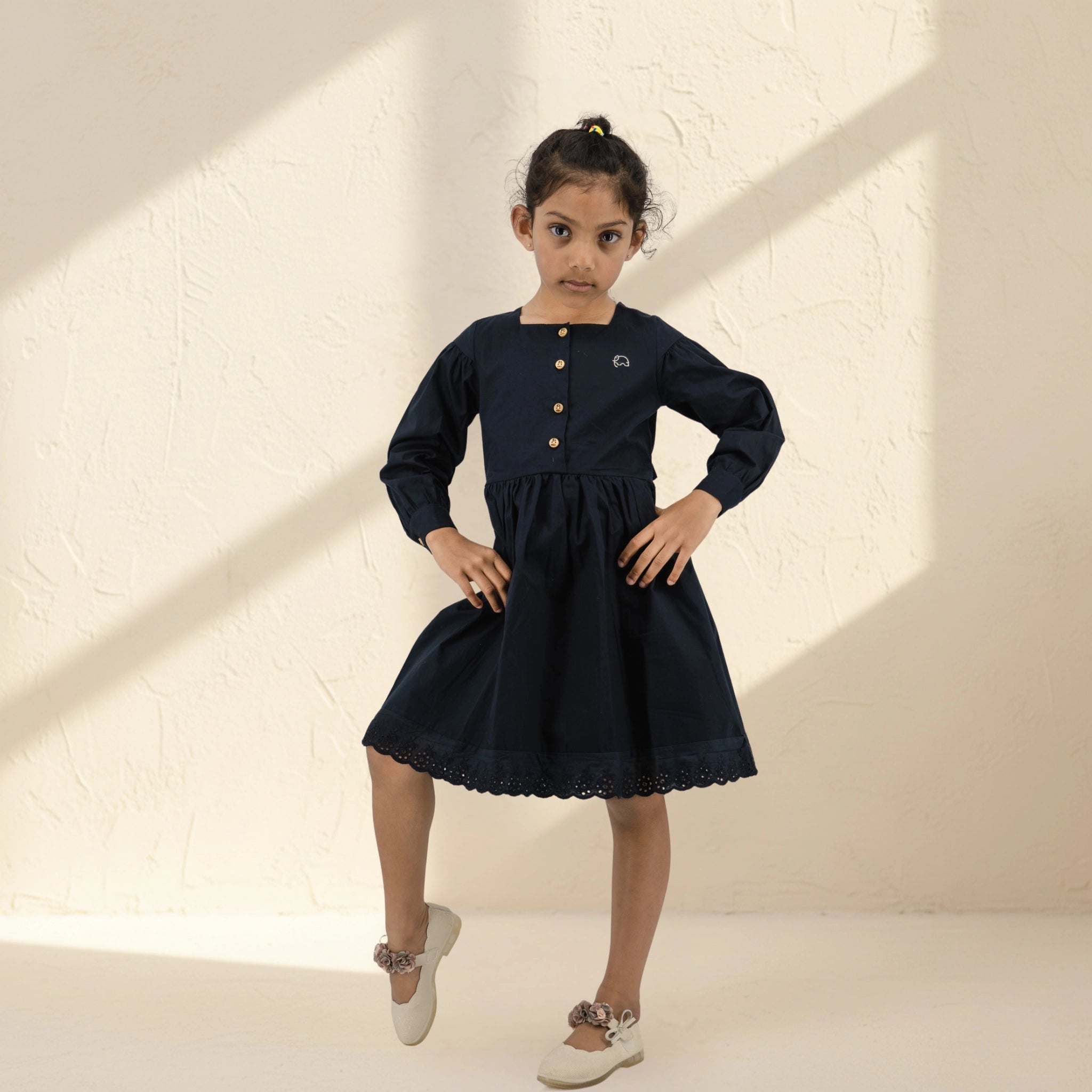 Black long puff sleeve cotton dress for girls by Karee, sustainable kidswear made from pure cotton, comfortable and eco-friendly clothing for children.