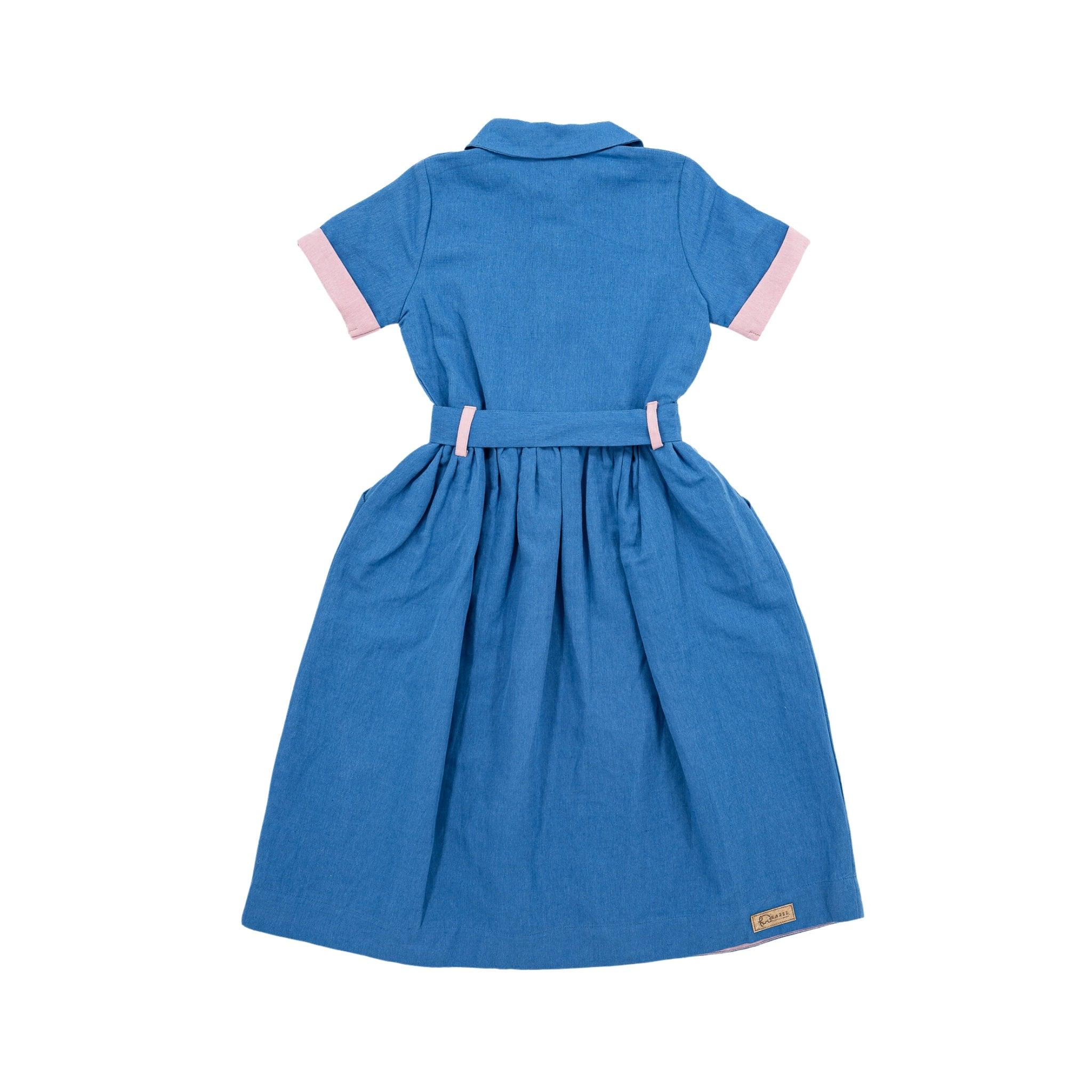 Karee's Parisian Blue Linen Dress for Girls with short sleeves, pink cuffs, a cinched waist, and a collar, displayed against a white background.