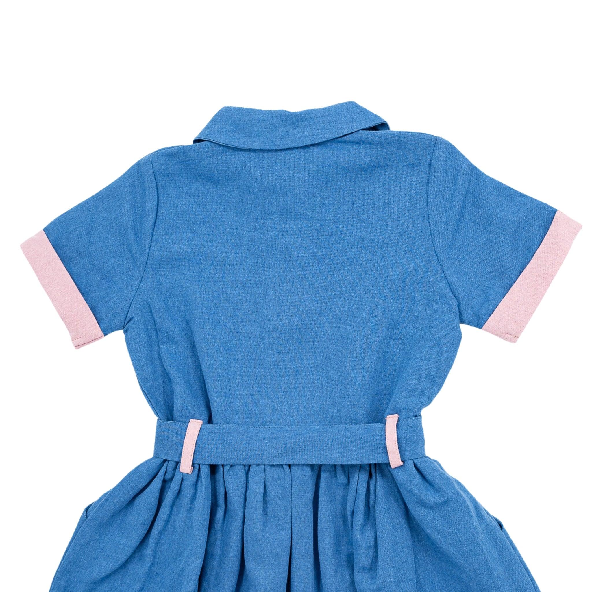 Blue Karee Parisian Blue Linen Dress for Girls with short sleeves, pink cuffs, and a cinched waist displayed against a white background.