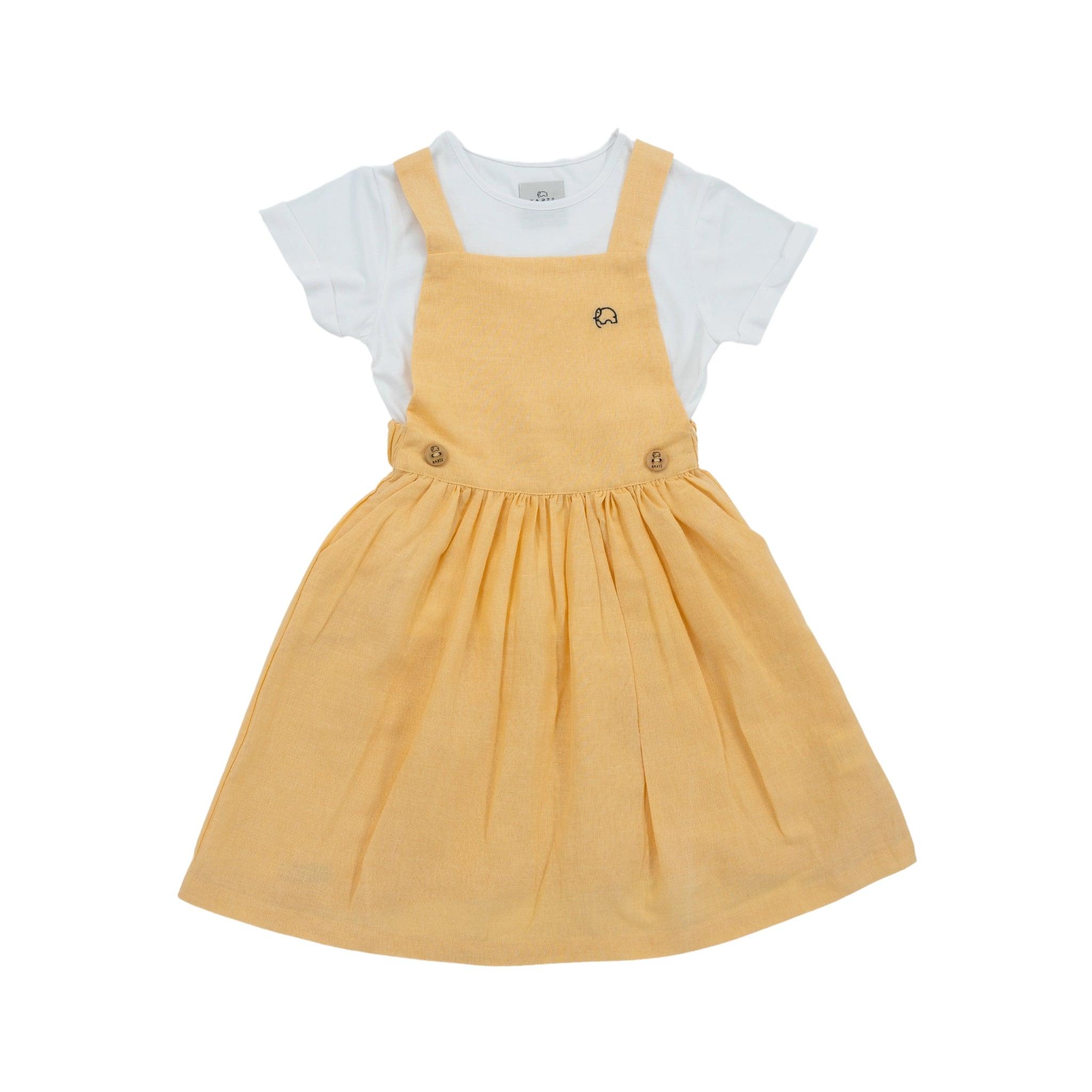 A yellow toddler Golden Fleece Linen Pinafore dress made from premium linen cotton, paired with a white t-shirt, displayed on a white background by Karee.