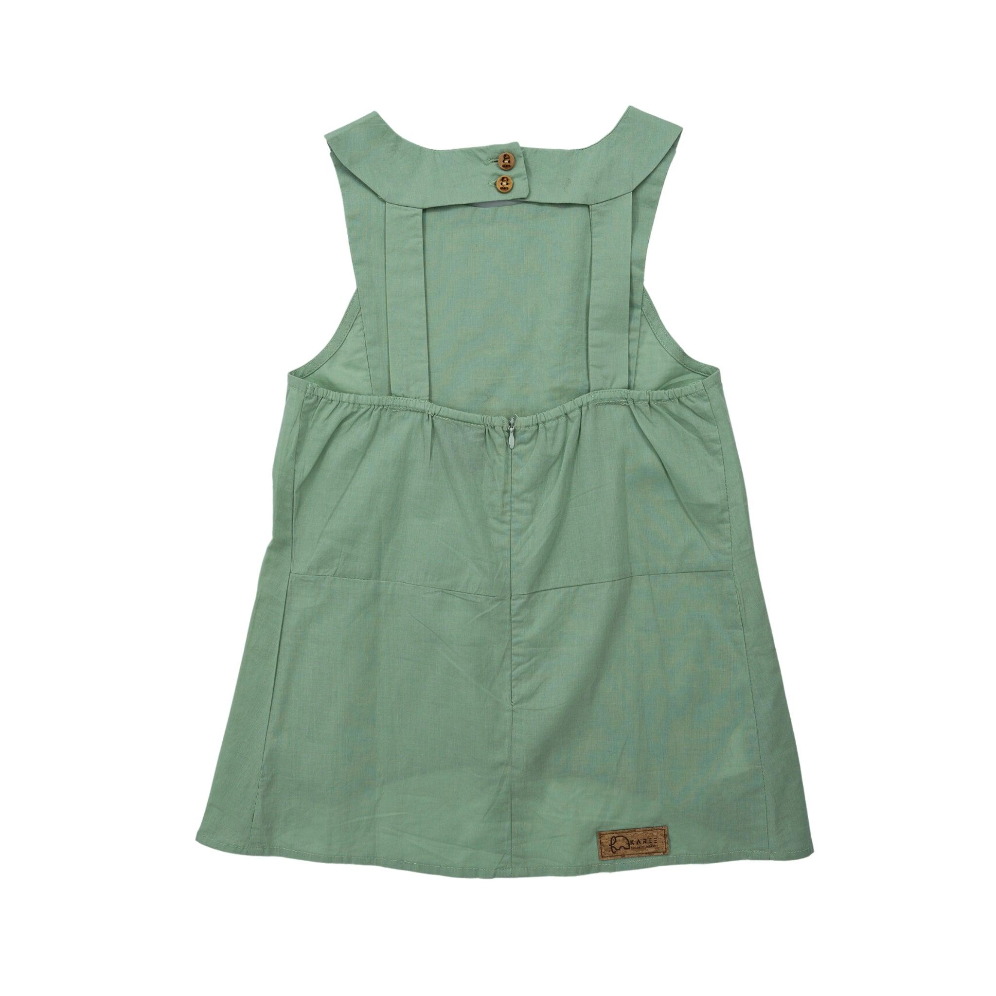 A smoke green breathable cotton bib neck top for kids with a button at the back and a brand tag on the front bottom left by Karee.