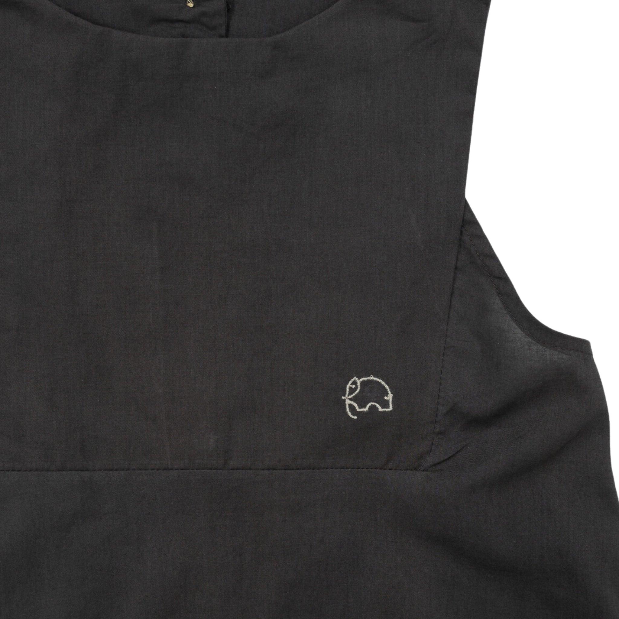 Close-up of a Plum Kitten Cotton Bib Neck Top for Kids by Karee with a small white embroidered car logo near the lower left side, designed as sustainable children’s clothing.
