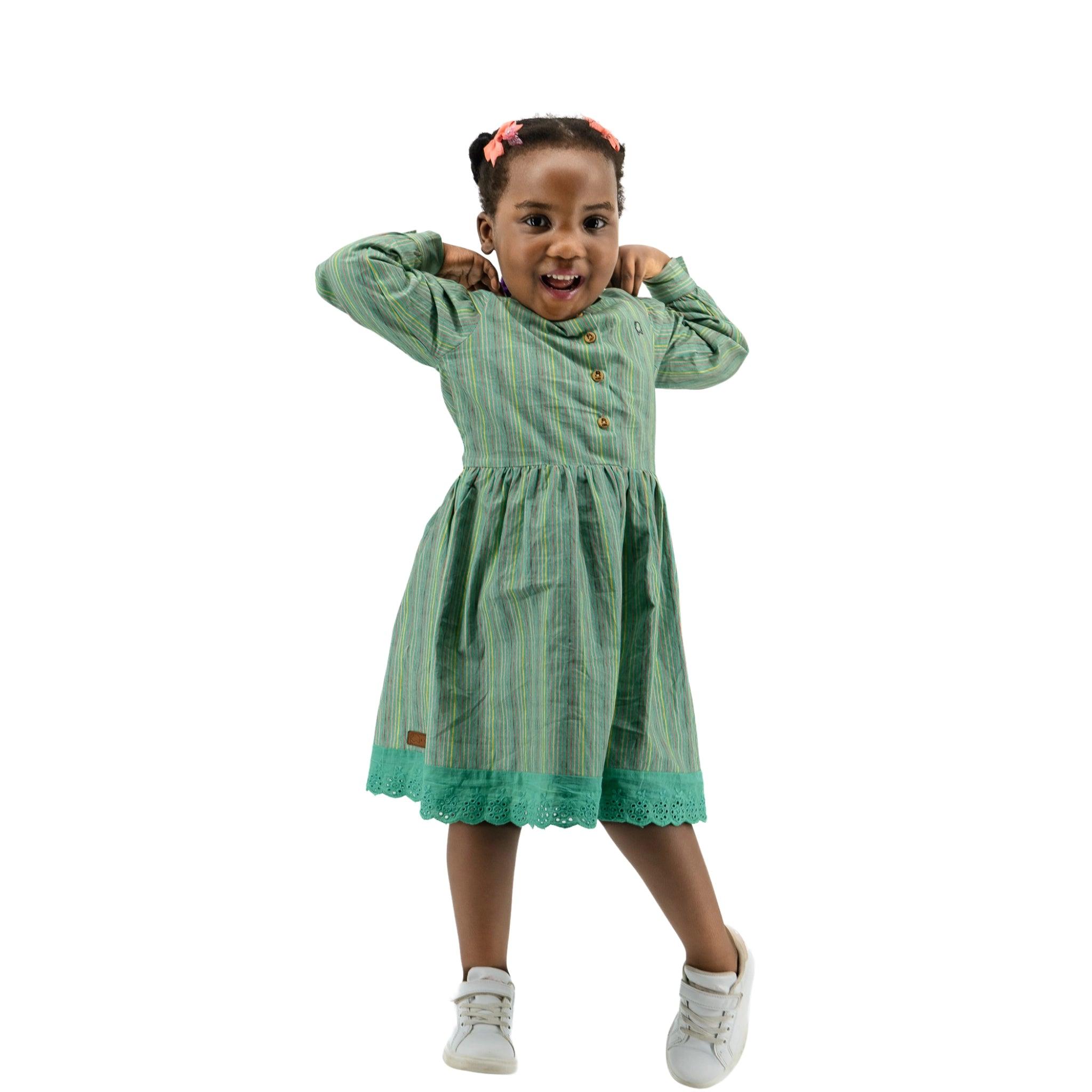 An eco-friendly girl in a sustainable Green Striped Long Puff Sleeve Cotton Dress by Karee.