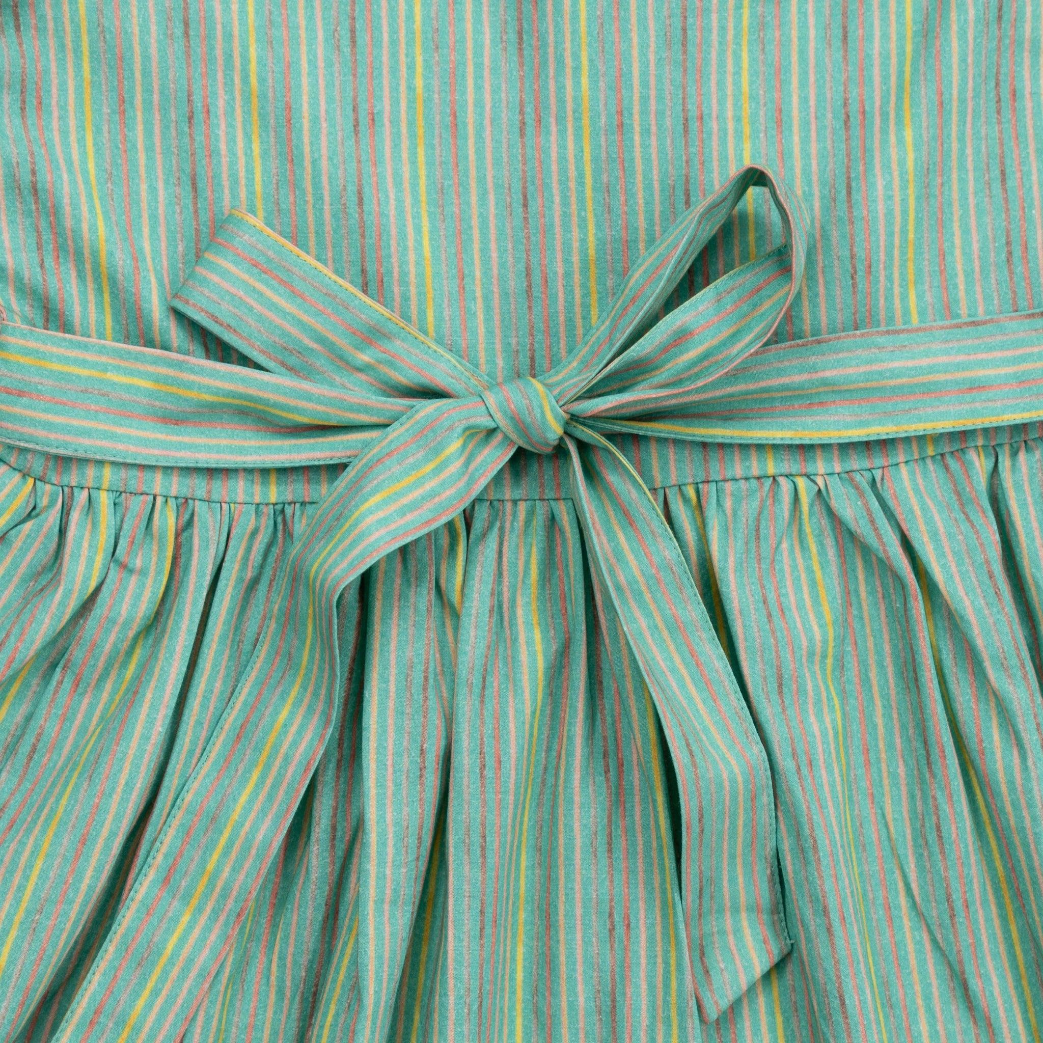 A sustainable and eco-friendly close up of a Green Striped Long Puff Sleeve Cotton Dress by Karee in the world of fashion.