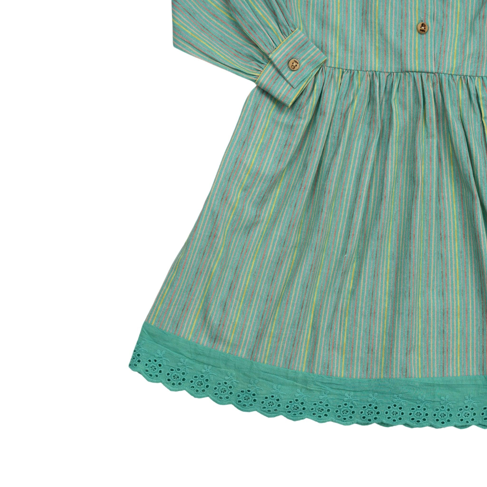 A child's eco-friendly Karee green striped long puff sleeve cotton dress with a lace trim at the hem, displayed on a white background.
