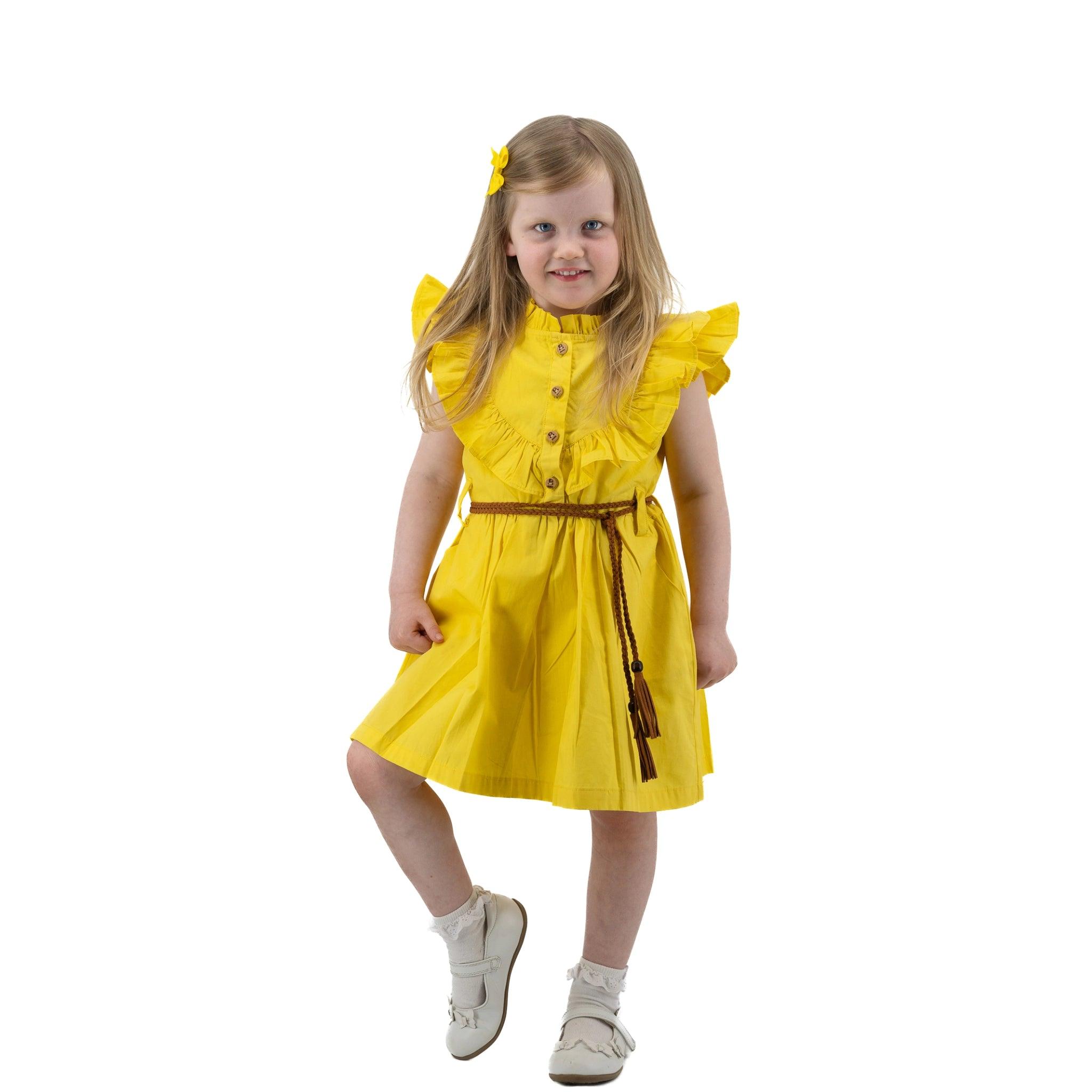 A fashionable little girl in a Karee Yellow Butterfly Sleeve Cotton Dress For Girls posing for a photo.