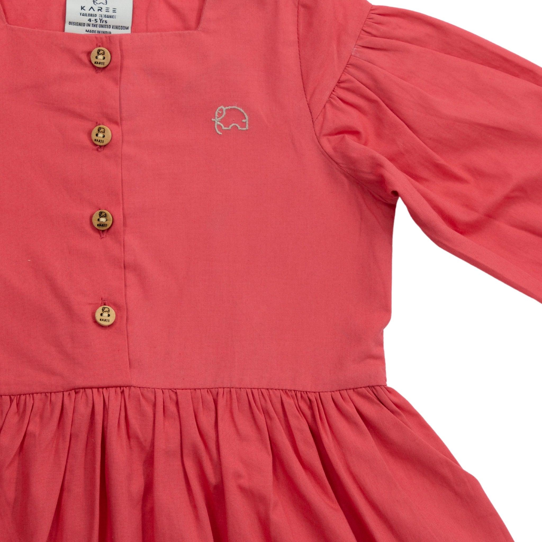Red Long Puff Sleeve Cotton Dress for toddlers featuring long puff sleeves, wooden buttons, and a small elephant embroidery on the chest by Karee.