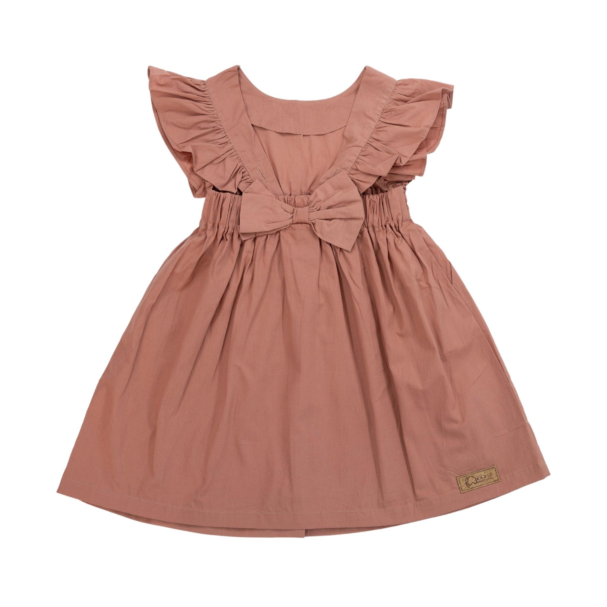 A Brick Dust Cotton Floral Dress for Girls by Karee, made of cotton fabric, with ruffled sleeves and a bow on the chest, displayed against a white background.