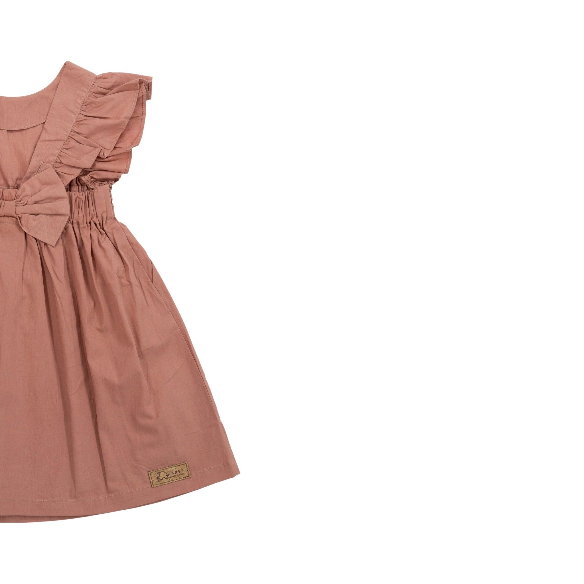 A Brick Dust Cotton Floral Dress for Girls from Karee, with a ruffled sleeve and a bow at the waist, displayed against a white background.