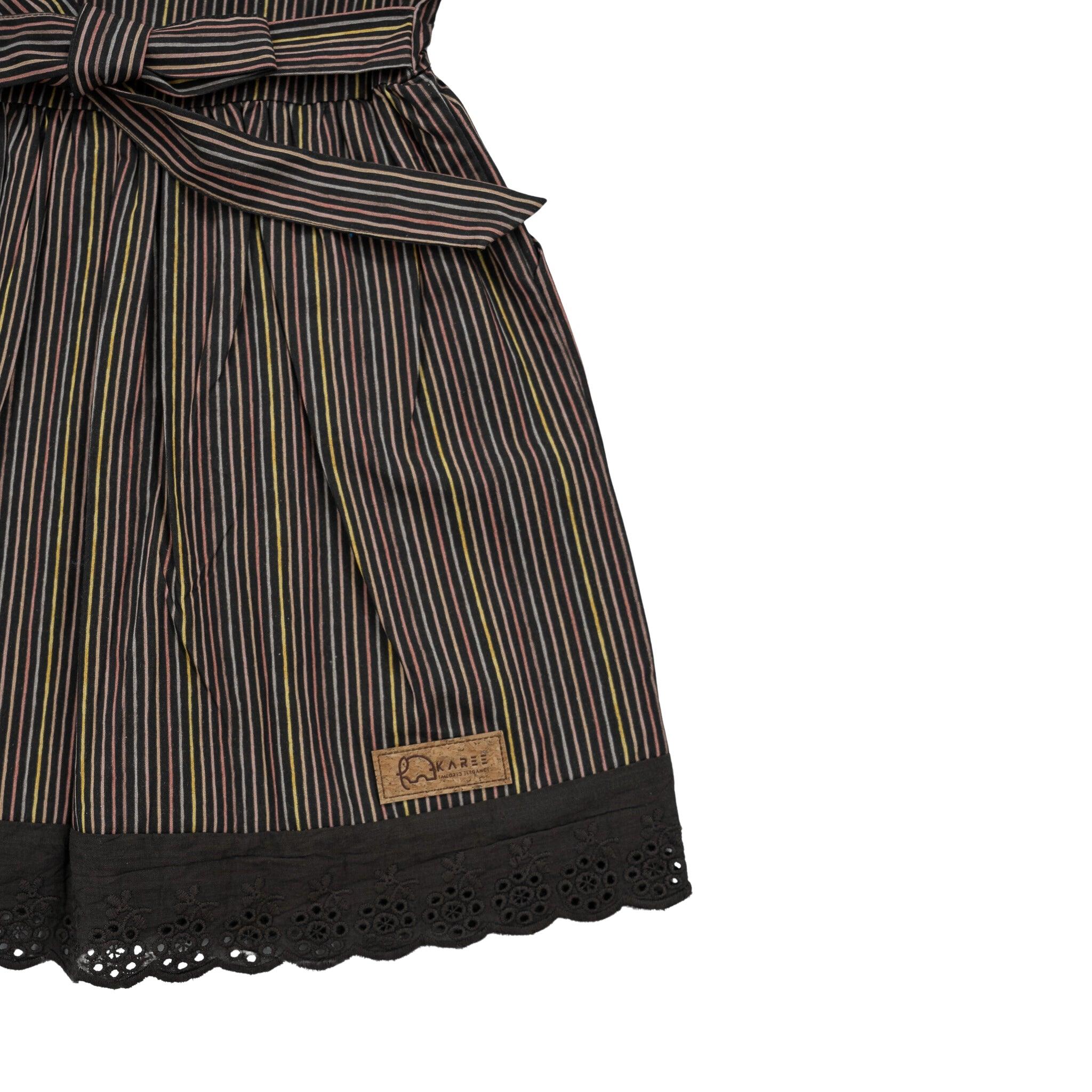 Black Striped full sleeve Cotton Dress with lace trim and a "Karee" label attached, made from premium cotton, isolated on a white background.