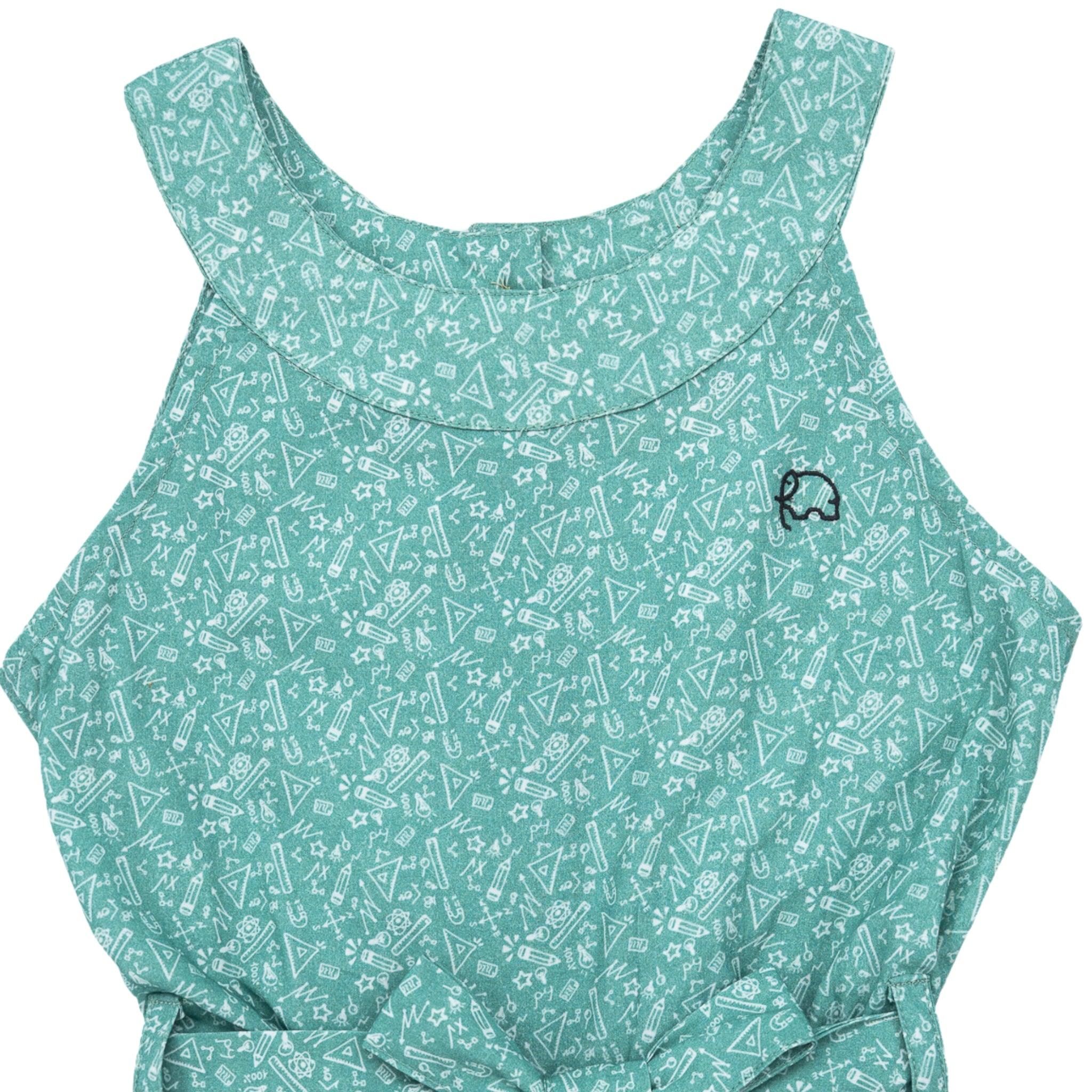 A Karee smoke green cotton jumpsuit for girls featuring a pattern of white triangles and a small black logo on the lower right side.