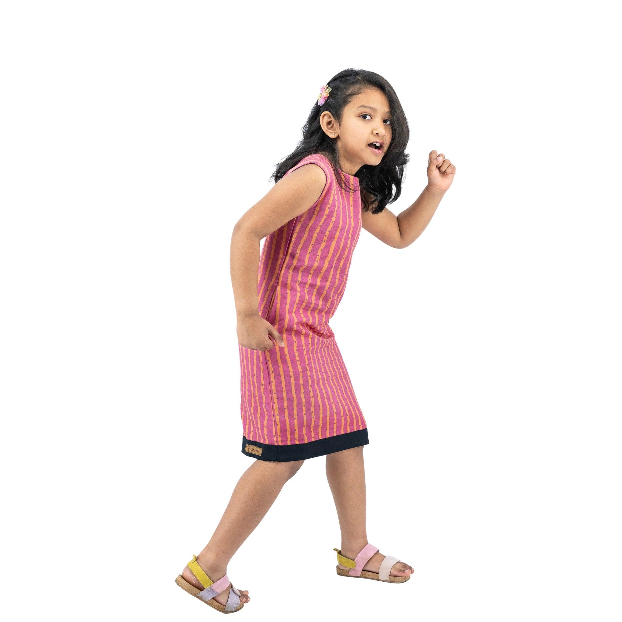 A Karee girl in a Linen Cotton Round Neck Frock for Kids in Lilac Rose dress.