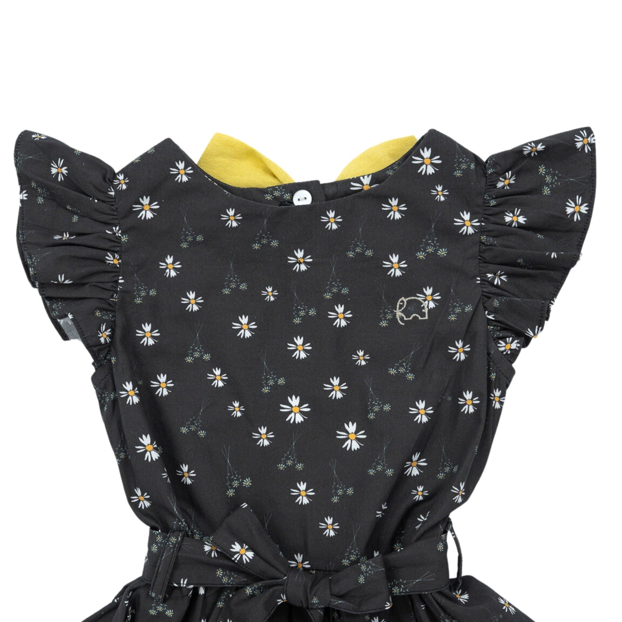 Children's elegant Petite Blossom Black Cotton Dress with a floral pattern and ruffled sleeves, featuring a yellow collar and a front button by Karee.