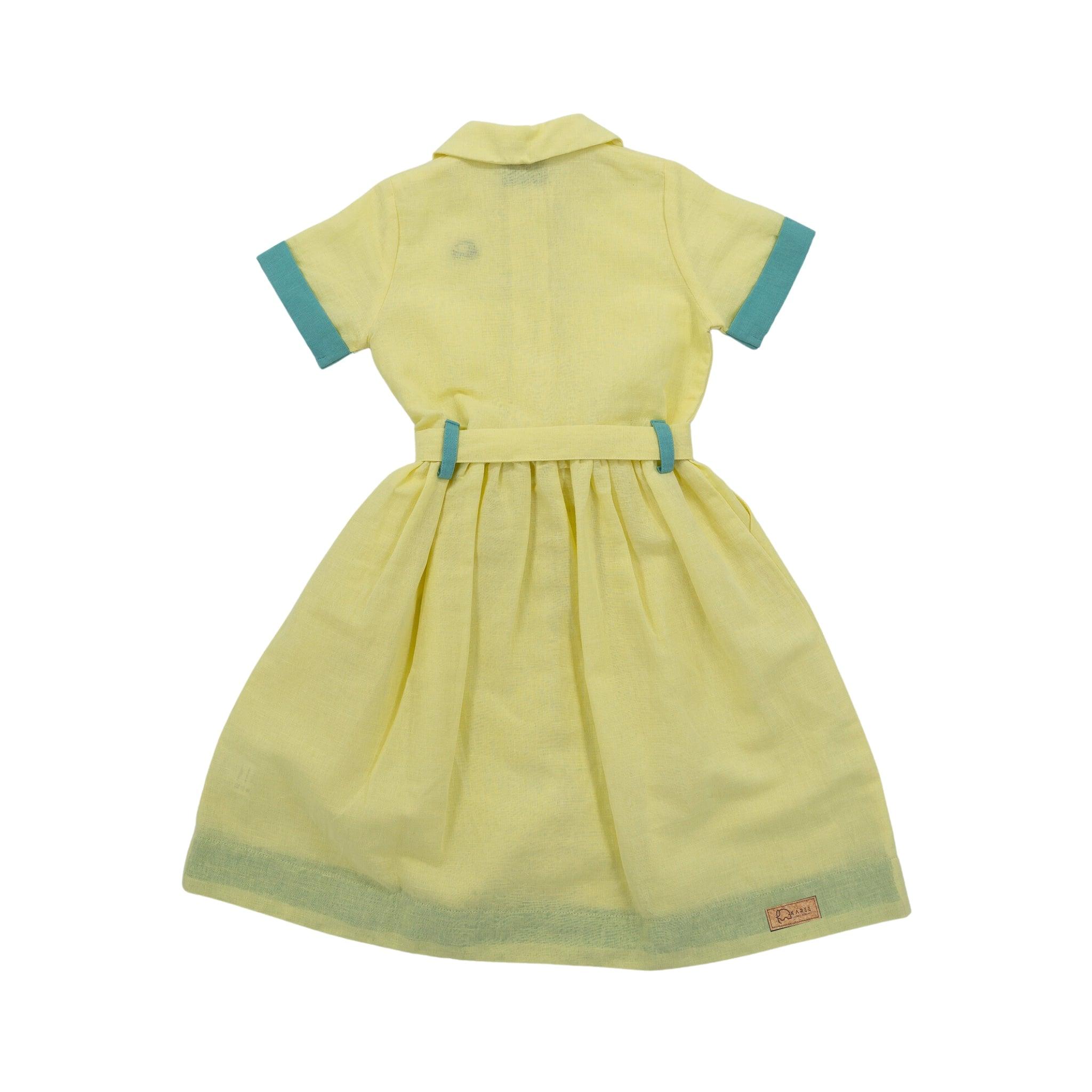 A Karee Elfin Yellow Linen Below Knee Length Dress for Girls with short turquoise-trimmed sleeves and collar, and a pleated skirt, displayed on a white background.