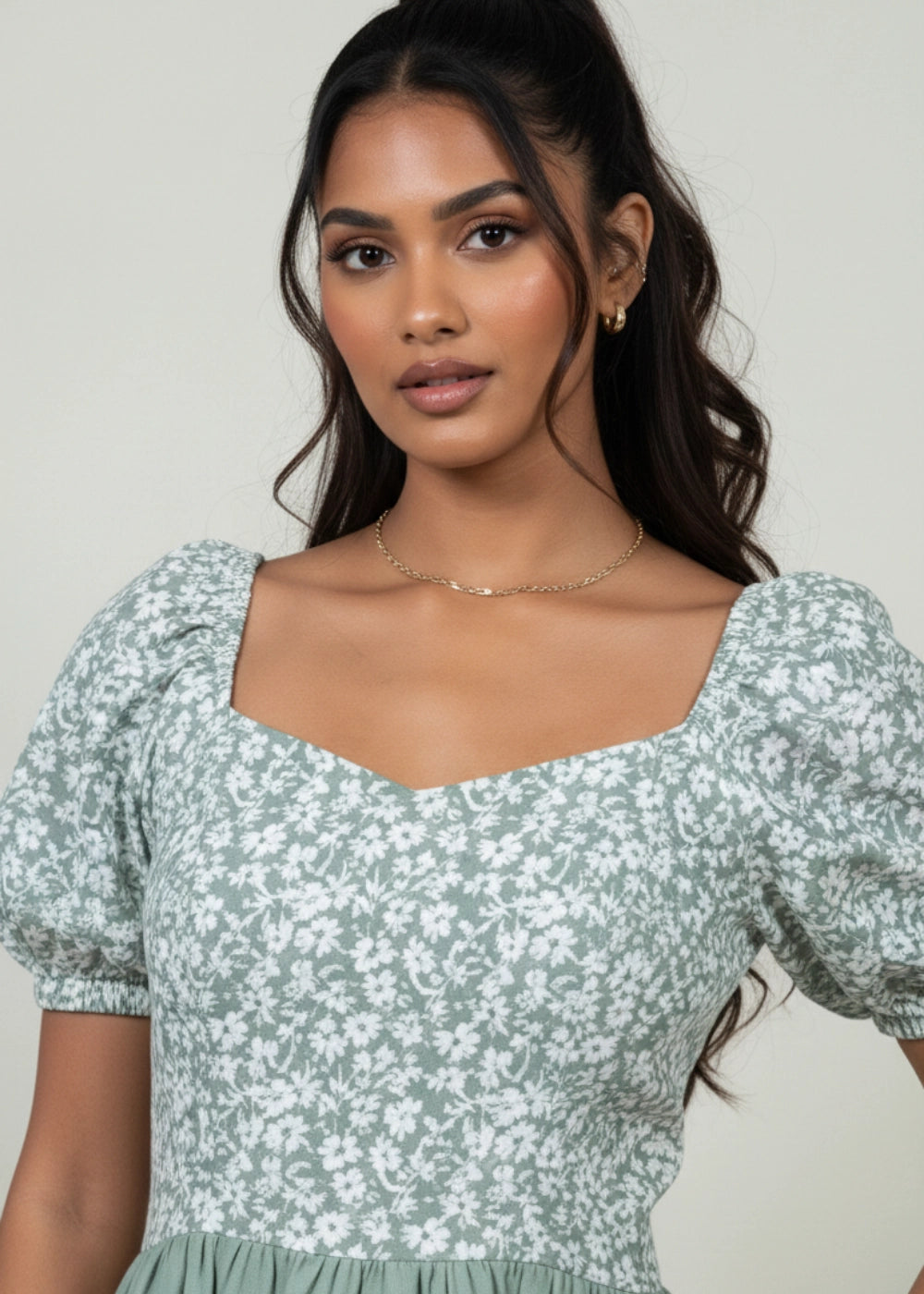 Sirocco Blooms Green Fit & Flare Dress — front view, floral printed bodice, puff sleeves, solid green skirt, cotton-linen fabric.