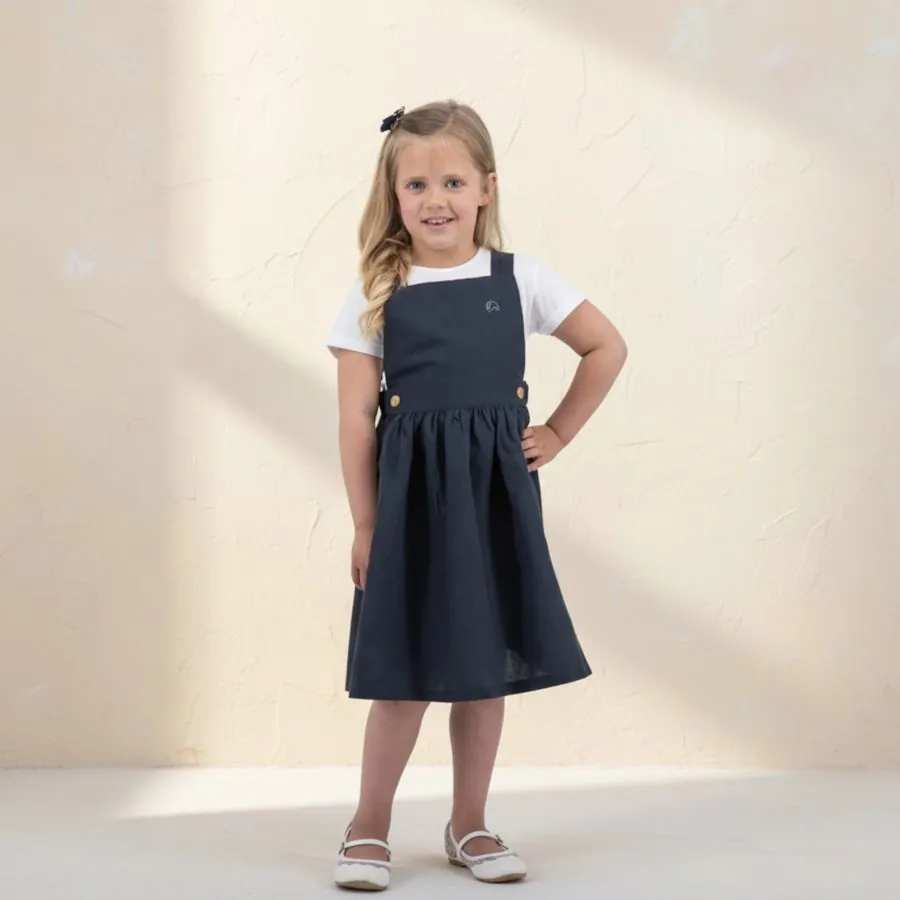 The Pinafore Set in Black ebony, worn by a child
